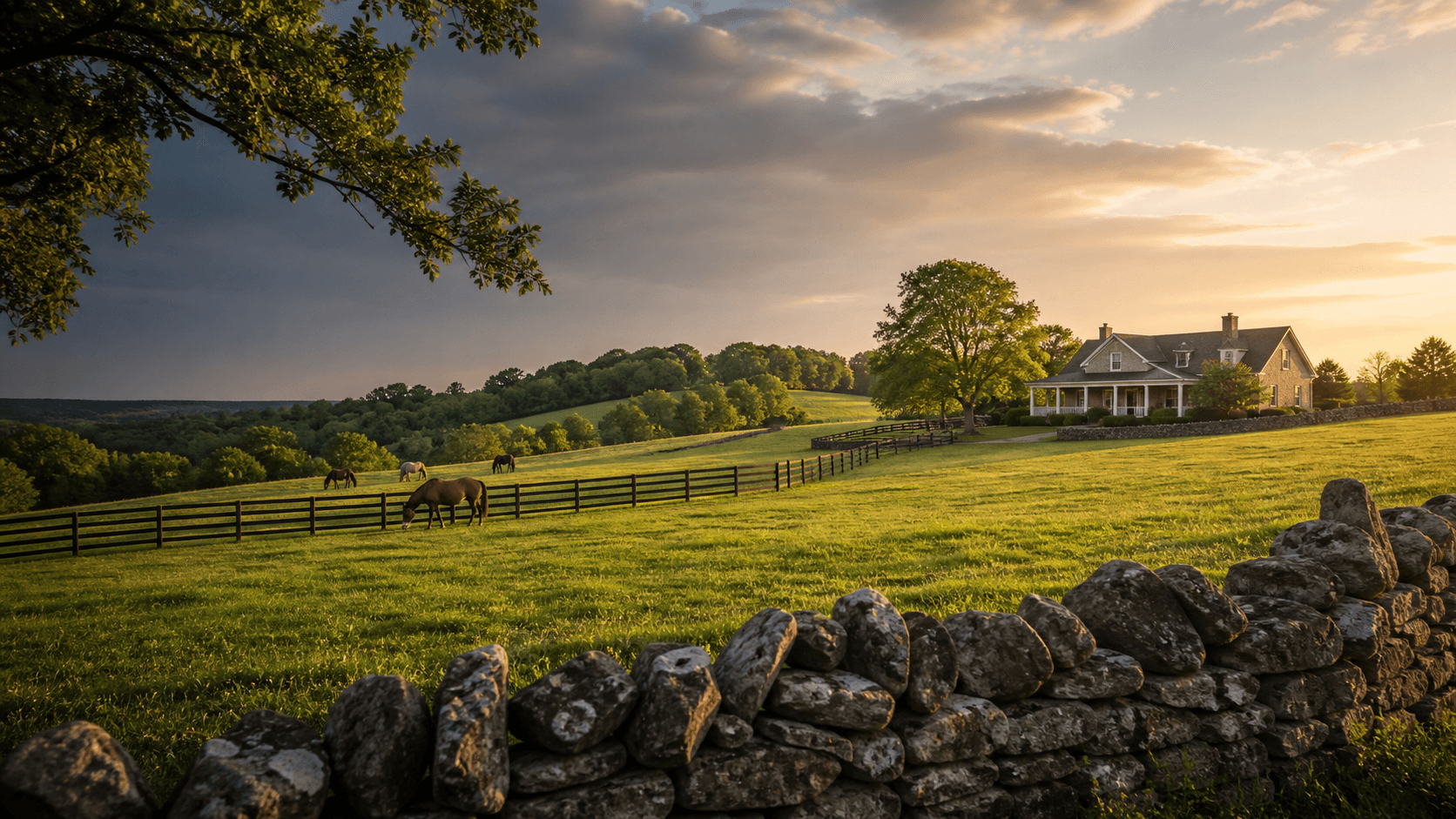 Kentucky countryside with rolling hills, a farmhouse, horse pasture, and stone fence